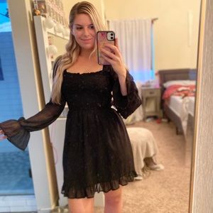 Black smocked long sleeve dress with sheer sleeves